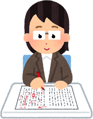 校正紙に赤入れする女性